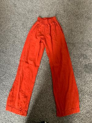 Orange high waisted trousers