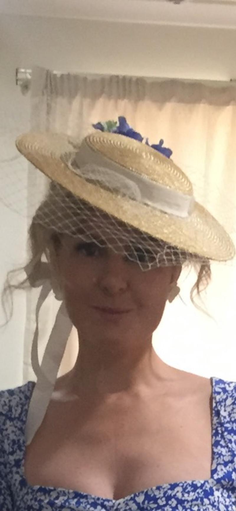 Straw boater with white netting and ribbon